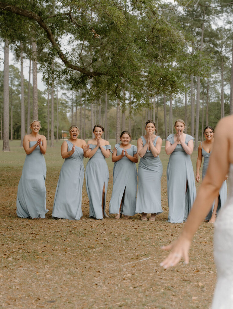 Bridesmaids seeing the bride for the first time during their first look.