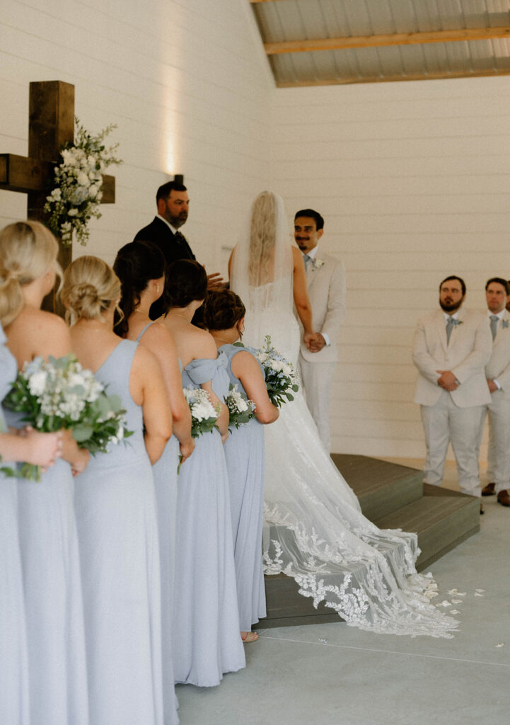 Bride and groom on the stage at the wedding ceremony at Mount Pleasant Lodge.