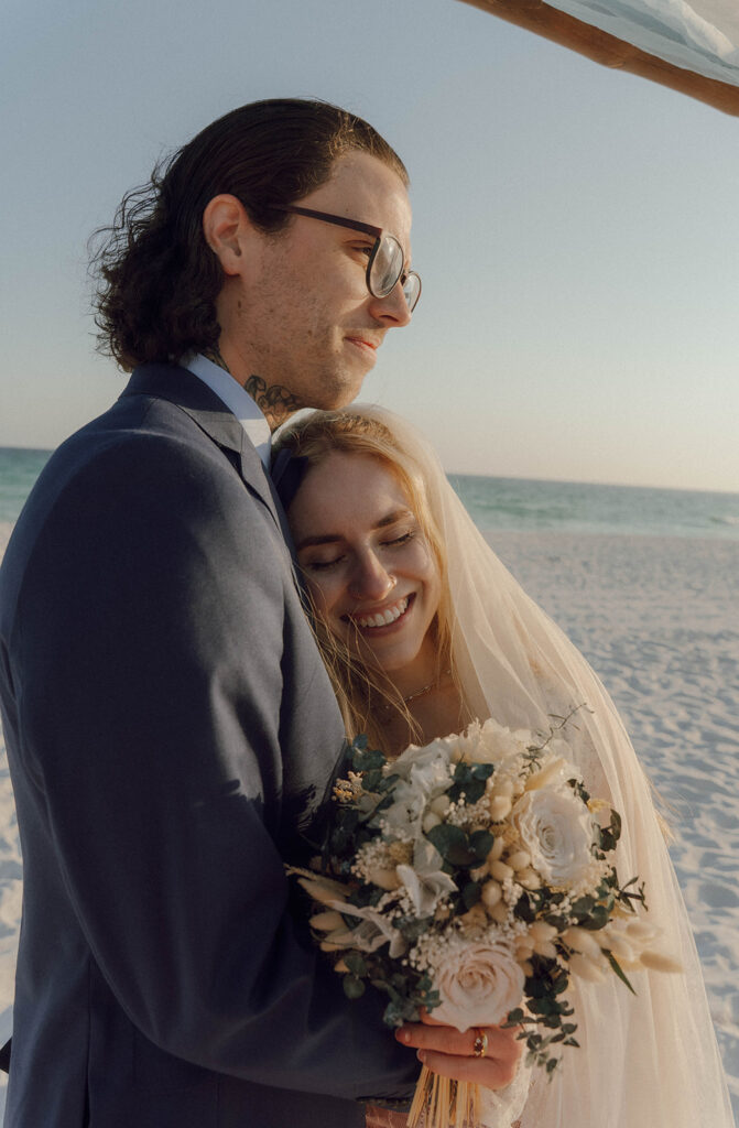 Bride and groom hugging at their Fort Walton beach wedding.