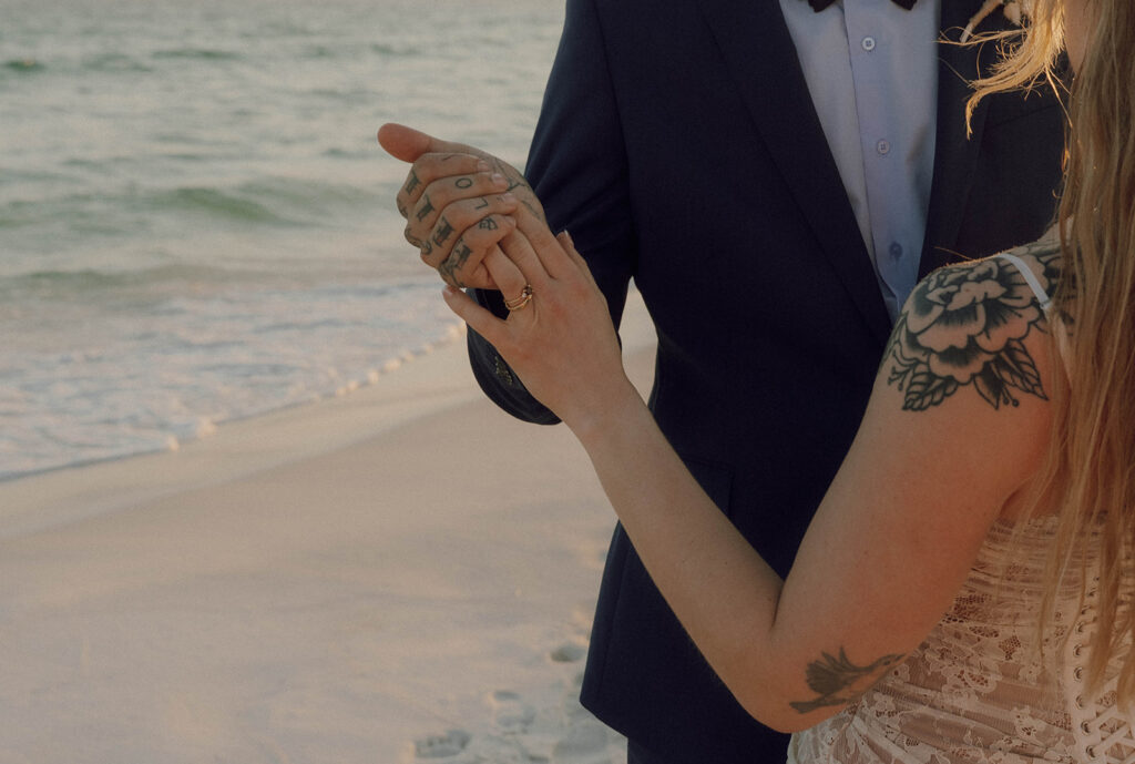 Newlyweds holding hands after their wedding ceremony. 