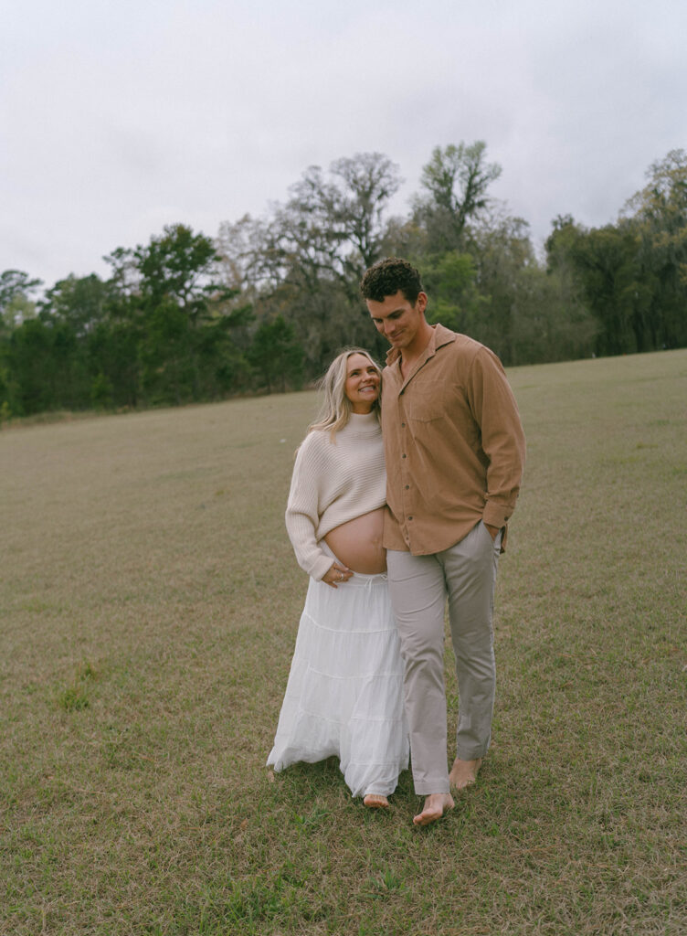 A woman smiling up at her husband.