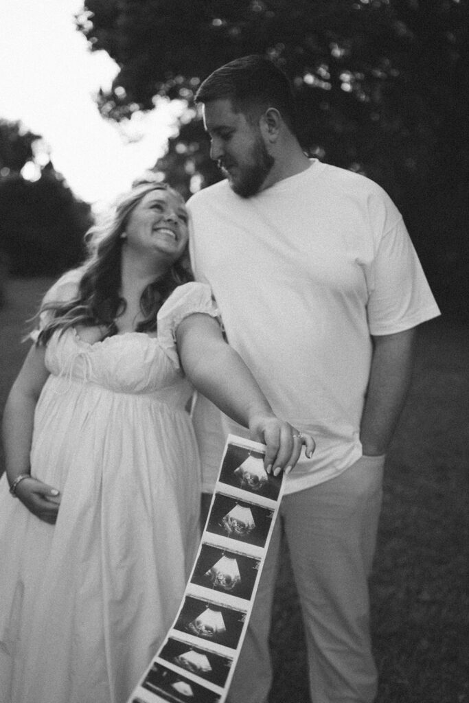 documentary style couples photoshoot with sonogram strip
