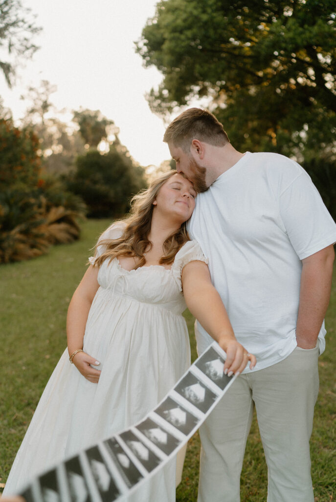 documentary style couples photoshoot with sonogram strip