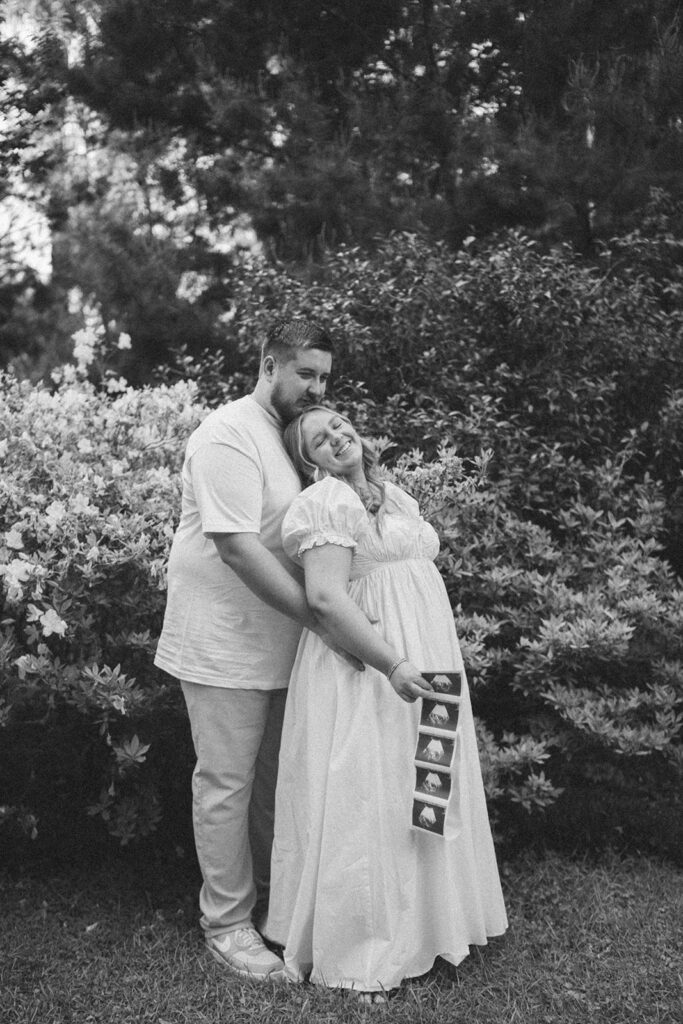 film photography maternity photoshoot with sonogram strip and picnic blanket
