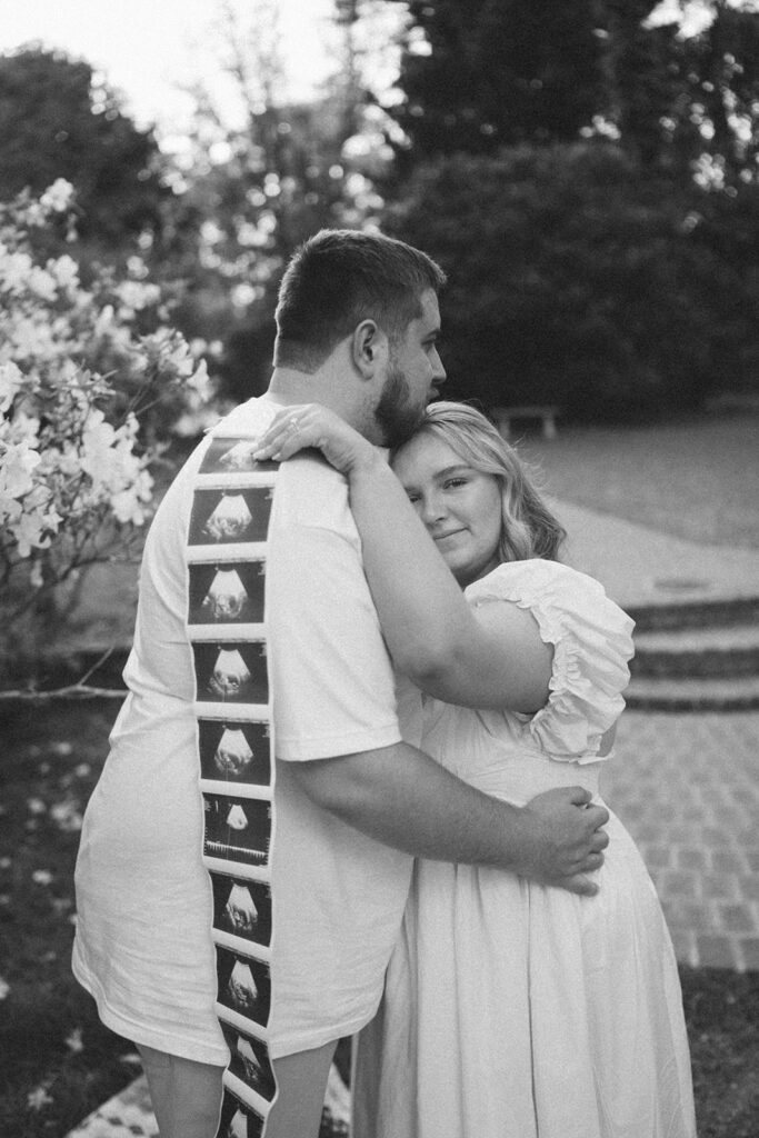 film photography maternity photoshoot with sonogram strip and picnic blanket