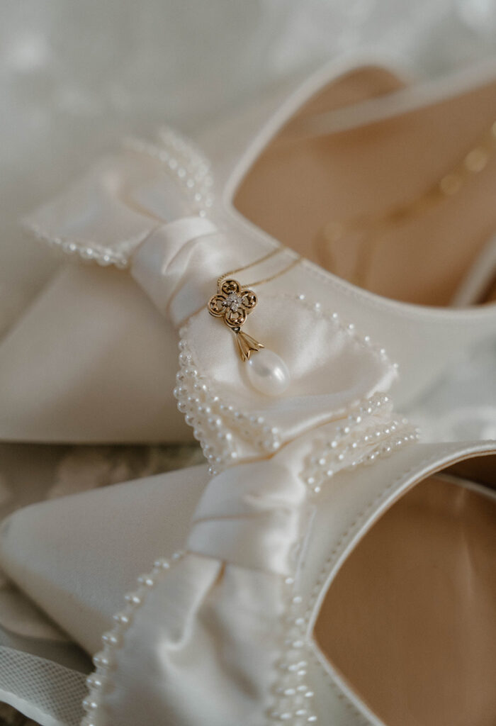 Pearl necklace and satin heels.