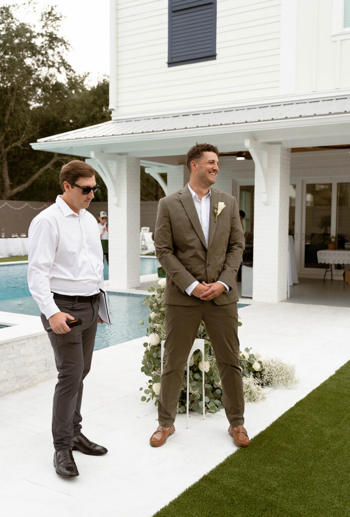 Groom waiting for his bride to walk down the aisle at their Santa Rosa Beach wedding.