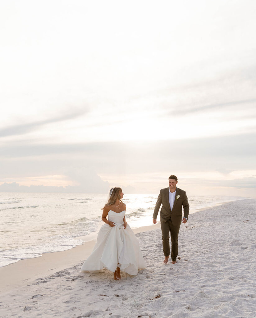 Couple running along Santa Rosa Beach.