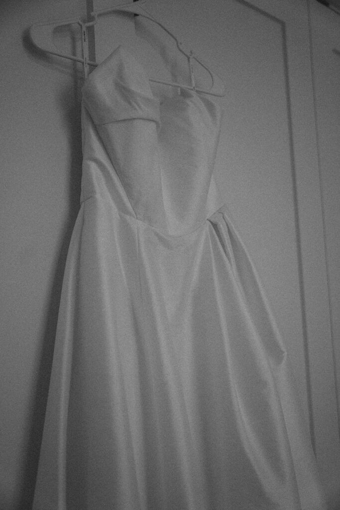 Wedding dress hanging.