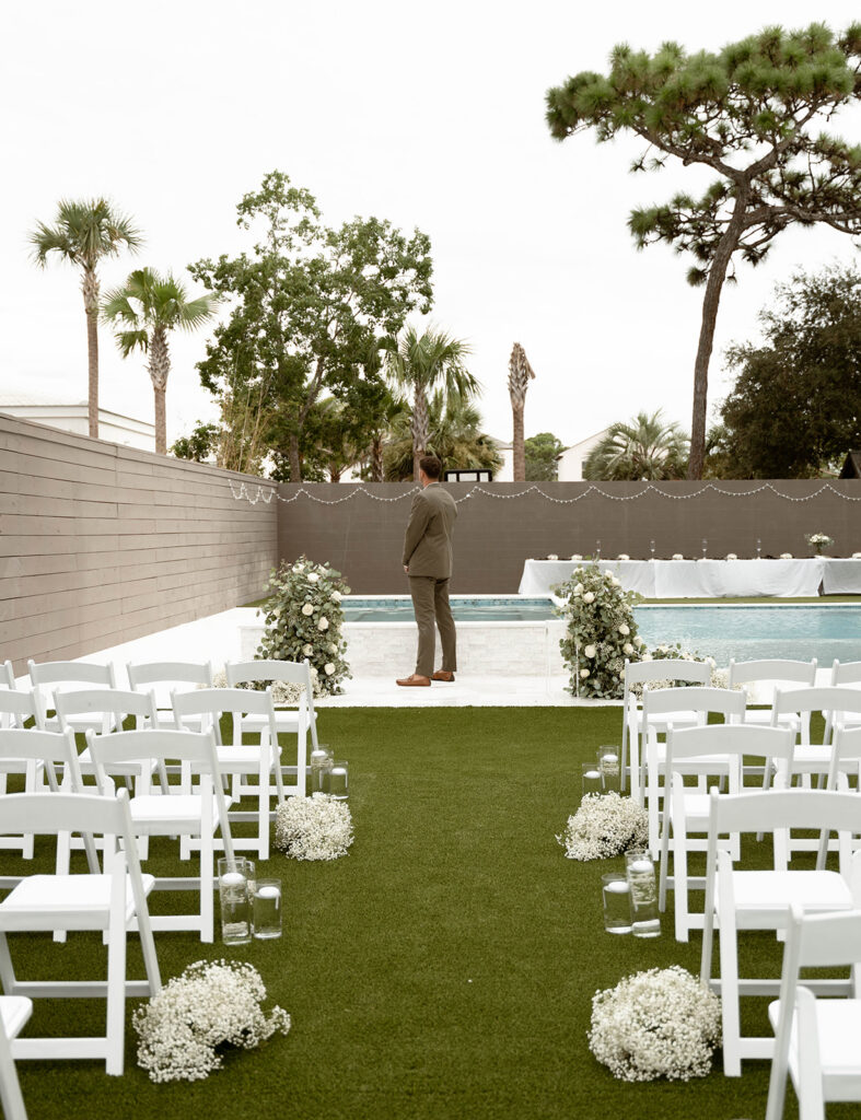 Groom standing at the altar. 